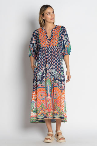 Woman wearing a colorful patterned dress on a white background Lula Life - Sarai Midi Dress - Navy